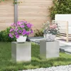 Two plant stands with potted plants in a garden setting. Podgląd zdjęcia produktu