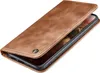 A brown leather flip case for a smartphone is shown from a diagonal angle, with the front cover partially open. Produktbild-Vorschau