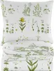 A folded duvet and pillowcase set with a botanical print. Produktbild-Vorschau