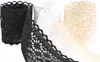 Three rolls of lace trim in different colors (black, white, and cream) are shown against a white background. Produktbild-Vorschau