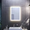 A modern bathroom with a sink, faucet, and a lit mirror. Náhled obrázku produktu