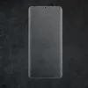 A clear screen protector for a smartphone is shown from a top-down perspective on a dark, textured background. Produktbild-Vorschau