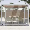 A transparent outdoor curtain is set up around a patio dining area, protecting a table and chairs from the elements. Náhled obrázku produktu