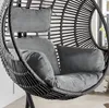 A close-up view of a gray hanging chair with cushions. Produktbild-Vorschau