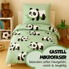 A child's bed with panda-themed bedding, including a duvet cover and pillowcase, in a bedroom setting with a shelf of toys and books. Produktbild-Vorschau