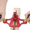 Hands using a woodworking tool on a piece of wood. Produktbild-Vorschau