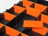 Close-up view of an open black organizer box with orange dividers, showing multiple compartments. Anteprima dell’immagine prodotto