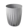 A gray plastic plant pot with a ribbed texture, shown against a white background. Podgląd zdjęcia produktu