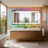 A modern bathroom with a large LED mirror, vanity, and bathtub. Produktbild-Vorschau