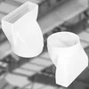 Two white plastic duct connectors are shown against a blurred industrial background. Voir les images du produit