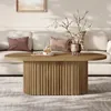 A living room scene with a couch and coffee table. Voir les images du produit