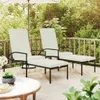 Two white lounge chairs with footrests on a wooden deck, surrounded by greenery and an umbrella. Produktbild-Vorschau