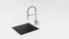 A modern kitchen sink and faucet set on a white countertop. Podgląd zdjęcia produktu