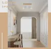 A hallway with a desk, chair, and a ceiling light. Náhľad obrázku produktu