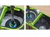 Two close-up views of a green and gray spin mop bucket system, showing the mop head in water and the wringing mechanism. Náhled obrázku produktu