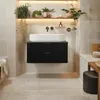 A modern bathroom vanity with a vessel sink, set against tiled walls and illuminated by warm lighting. Anteprima dell’immagine prodotto