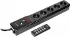 A black power strip with multiple outlets and a remote control on a white background. Produktbild-Vorschau