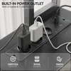 Close-up of a built-in power outlet with two charging adapters plugged in, and icons indicating power specifications. Anteprima dell’immagine prodotto