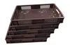 A stack of brown plastic crates on a white background. Produktbild-Vorschau