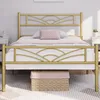 A gold metal bed frame with a cloud pattern headboard is shown in a bedroom setting. Produktbild-Vorschau