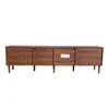 A long, low media console with four doors and tapered legs, shown against a white background. Voir les images du produit