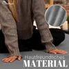 A person wearing a grey sweater is sitting with their hands on their lap, with a close-up inset of the fabric. Produktbild-Vorschau