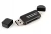 A black USB multi-function card reader/writer with its cap off, lying on a white background. Produktbild-Vorschau