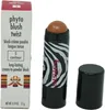 A makeup product, a blush stick and its packaging, displayed against a white background. Podgląd zdjęcia produktu