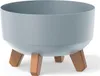 A light gray planter pot with three brown legs, shown on a white background. Anteprima dell’immagine prodotto