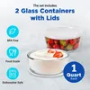 Two glass containers with lids, one filled with strawberries and the other with yogurt, are displayed against a light gray and white background. Informational icons and text are present on the left side of the image. Podgląd zdjęcia produktu