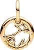 A close-up of a gold-colored Pisces zodiac charm with small clear stones. Podgląd zdjęcia produktu