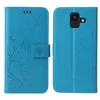 A blue flip cover phone case for a Samsung Galaxy A6 (2018) is shown from the front and back. Produktbild-Vorschau