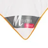 A close-up view of the corner of a white pillow with an orange trim and a label. Anteprima dell’immagine prodotto