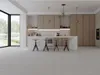 A modern kitchen with wooden cabinets, a marble island with stools, and large windows overlooking a garden. Produktbild-Vorschau