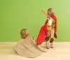 Two children playing dress-up with a horse costume and a blanket. Anteprima dell’immagine prodotto