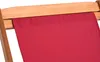 A close-up view of the top edge of a red fabric sling on a wooden chair frame. Náhľad obrázku produktu