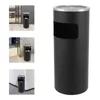 Collage of images showing a black outdoor trash can with an ashtray top in different settings. Voir les images du produit