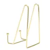 A standalone product shot of a gold-colored metal display stand. Podgląd zdjęcia produktu