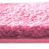 Close-up view of a pink bath mat. Náhled obrázku produktu