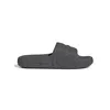 A single gray Adidas flip-flop is shown against a white background. Podgląd zdjęcia produktu