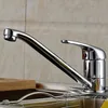 A close-up view of a chrome kitchen faucet over a sink. Produktbild-Vorschau