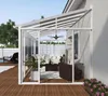 A sunroom attached to a house, furnished with outdoor furniture and a ceiling fan. Podgląd zdjęcia produktu