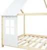 A close-up view of a wooden bed frame with a white house-shaped headboard and a slatted mattress base. Anteprima dell’immagine prodotto