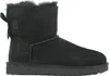 A black Ugg boot with a bow on the back, shown from the side against a white background. Produktbild-Vorschau