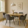 A dining room scene with a wooden table and chairs. Anteprima dell’immagine prodotto