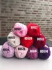 A pyramid of yarn balls with labels. Náhľad obrázku produktu