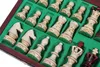 A close-up view of a set of chess pieces in a wooden box with green felt lining. Produktbild-Vorschau