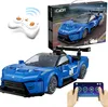 A blue remote-controlled toy car, its remote control, and the product packaging are displayed against a white background. Produktbild-Vorschau