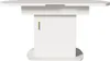 A white oval dining table with a pedestal base and a gold handle on a cabinet door. Anteprima dell’immagine prodotto