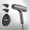 A professional studio shot of a hairdryer and its attachments against a light gray background. Anteprima dell’immagine prodotto